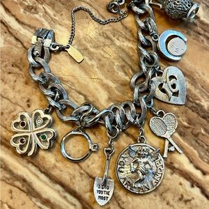 Monet charm bracelet with 8 charms.